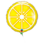 Yellow lemon-slice foil balloon on a black background with a green string descending from its bottom.