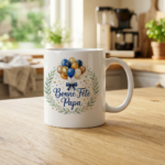White mug with a festive design: balloon bouquet and laurel wreath, text 'Bonne Fête Papa' in blue.